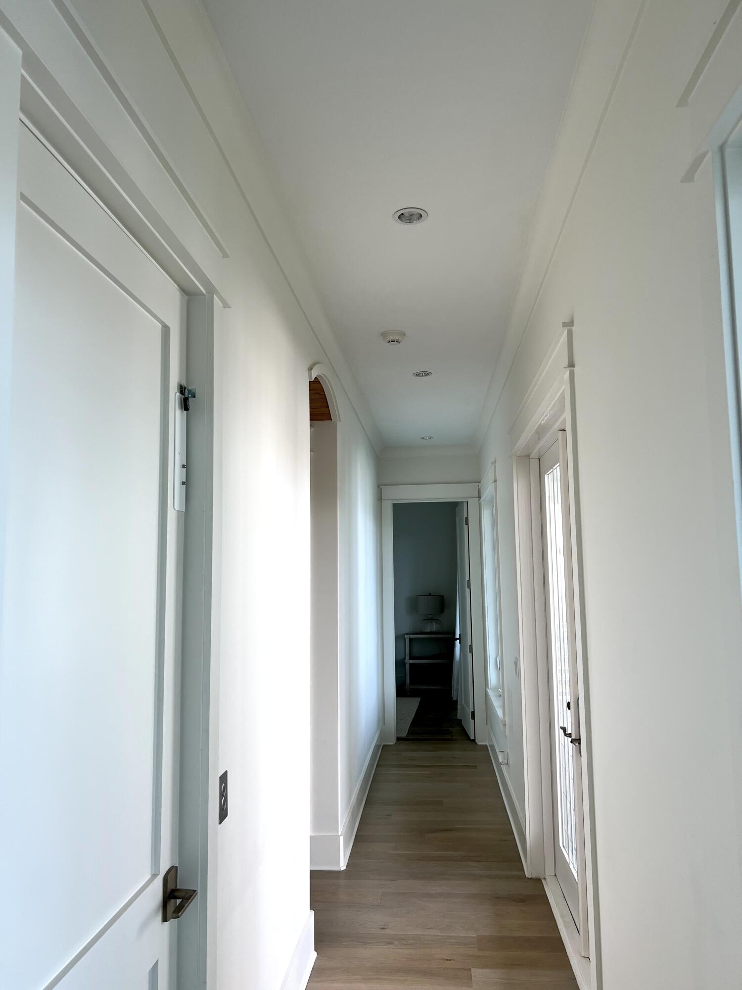 69 Brenda Lane Inlet Beach, FL 32461 - Photo 34 of 46 a view of a hallway with a livingroom and a hall with wooden floor