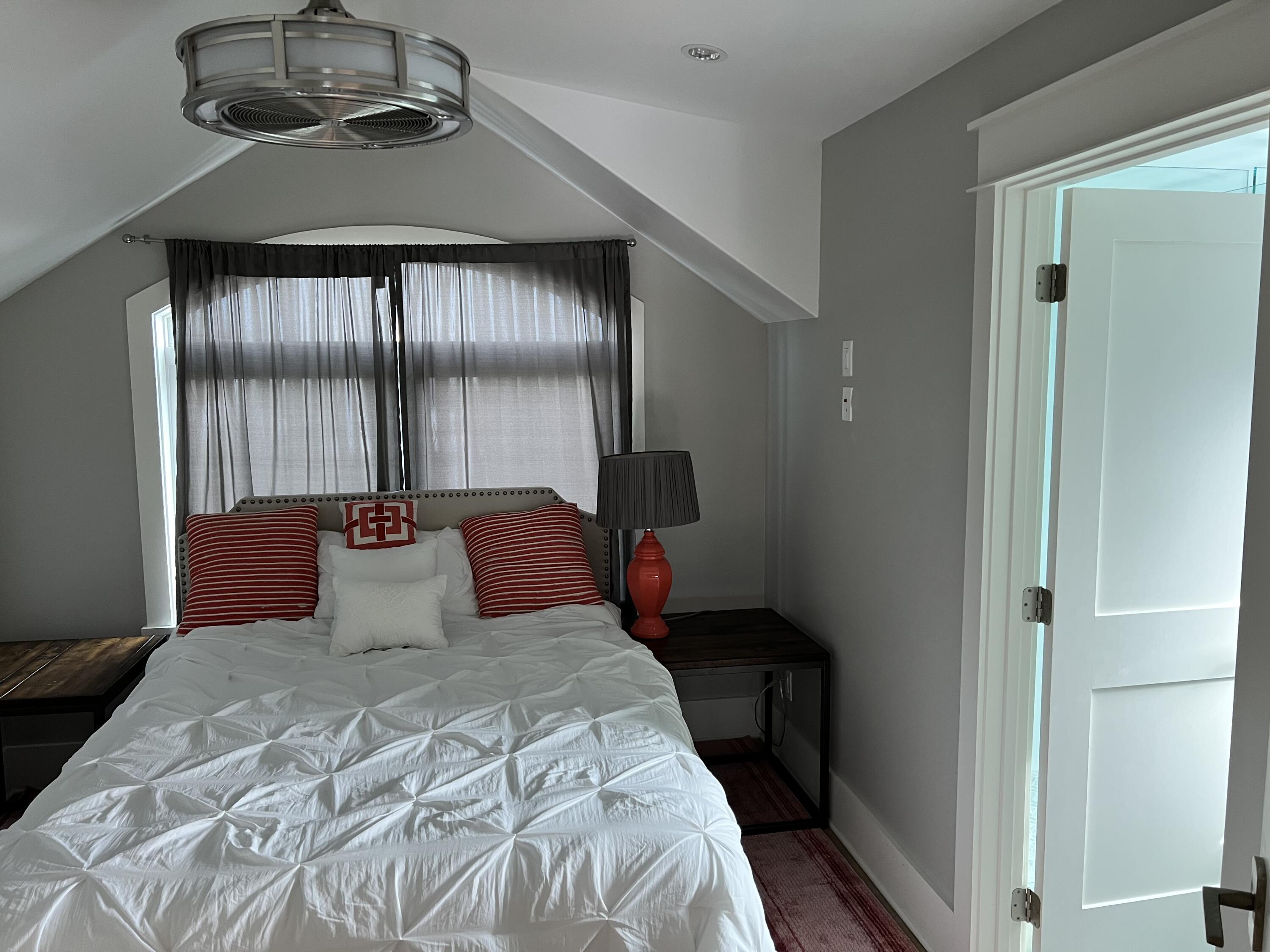 69 Brenda Lane Inlet Beach, FL 32461 - Photo 36 of 46 a bedroom with a bed and a chandelier