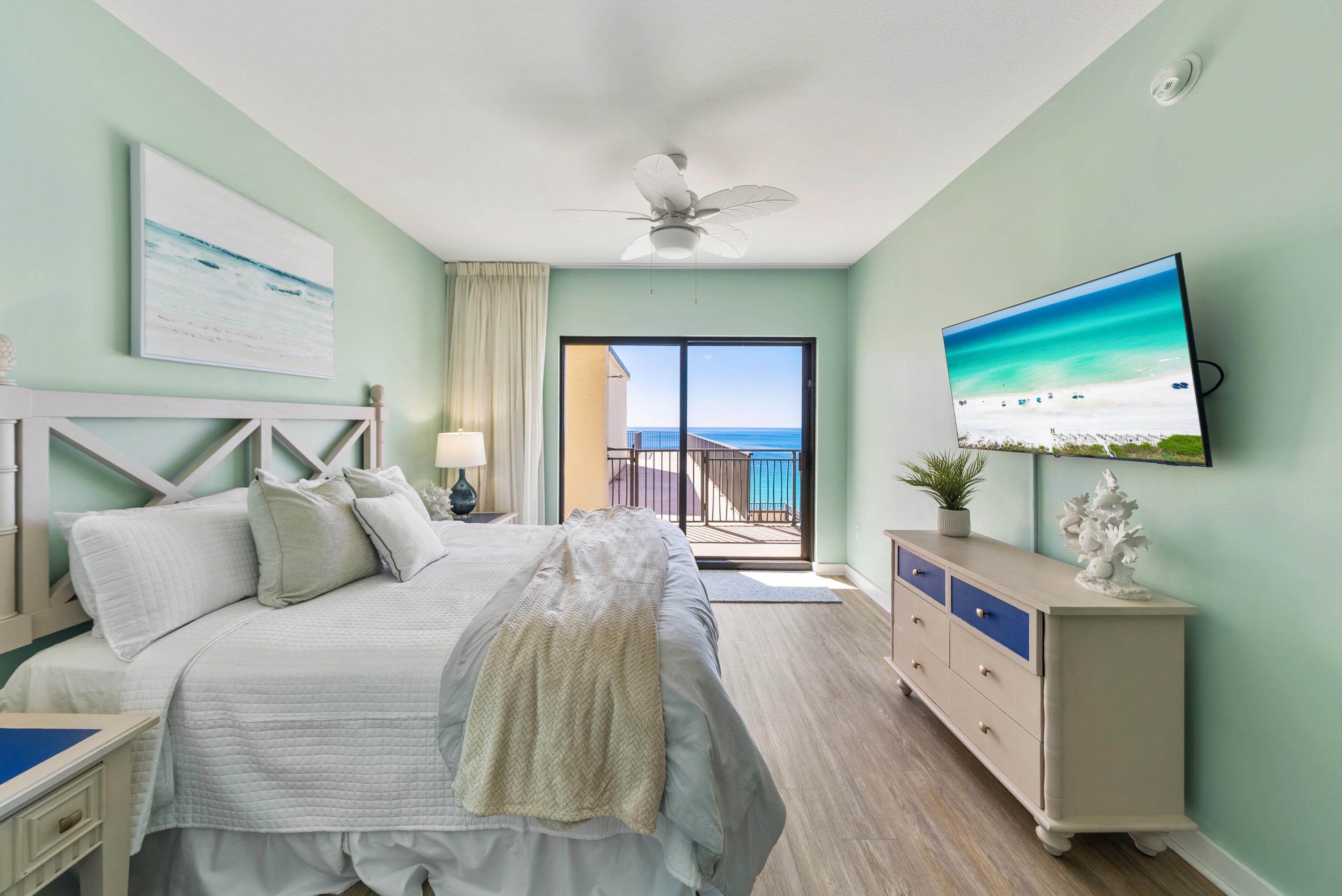 15100 Front Beach Road, Unit 1604 Panama City Beach, FL 32413 - Photo 18 of 66 a bedroom with a bed and a flat screen tv