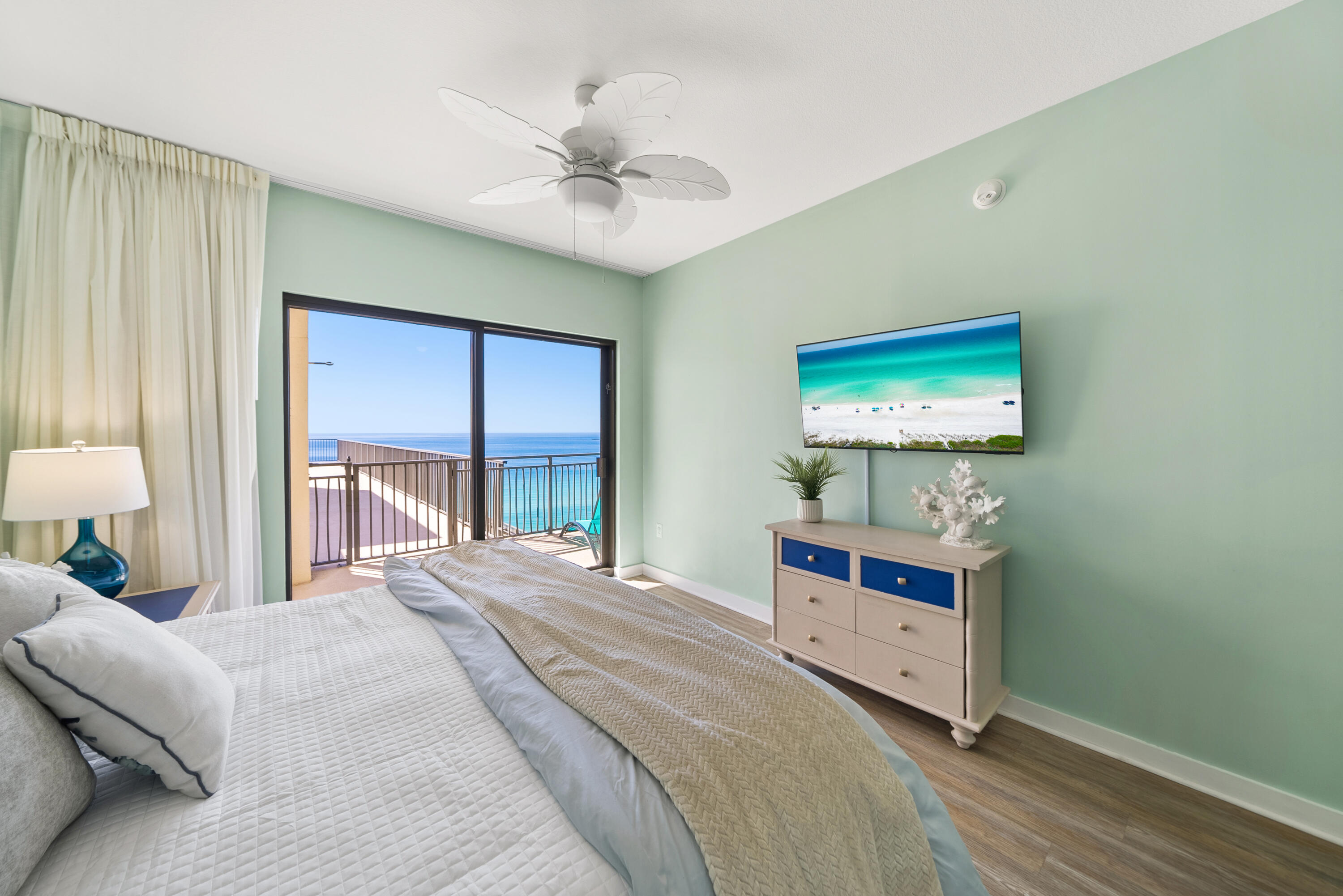15100 Front Beach Road, Unit 1604 Panama City Beach, FL 32413 - Photo 20 of 66 a bedroom with a bed and a flat screen tv