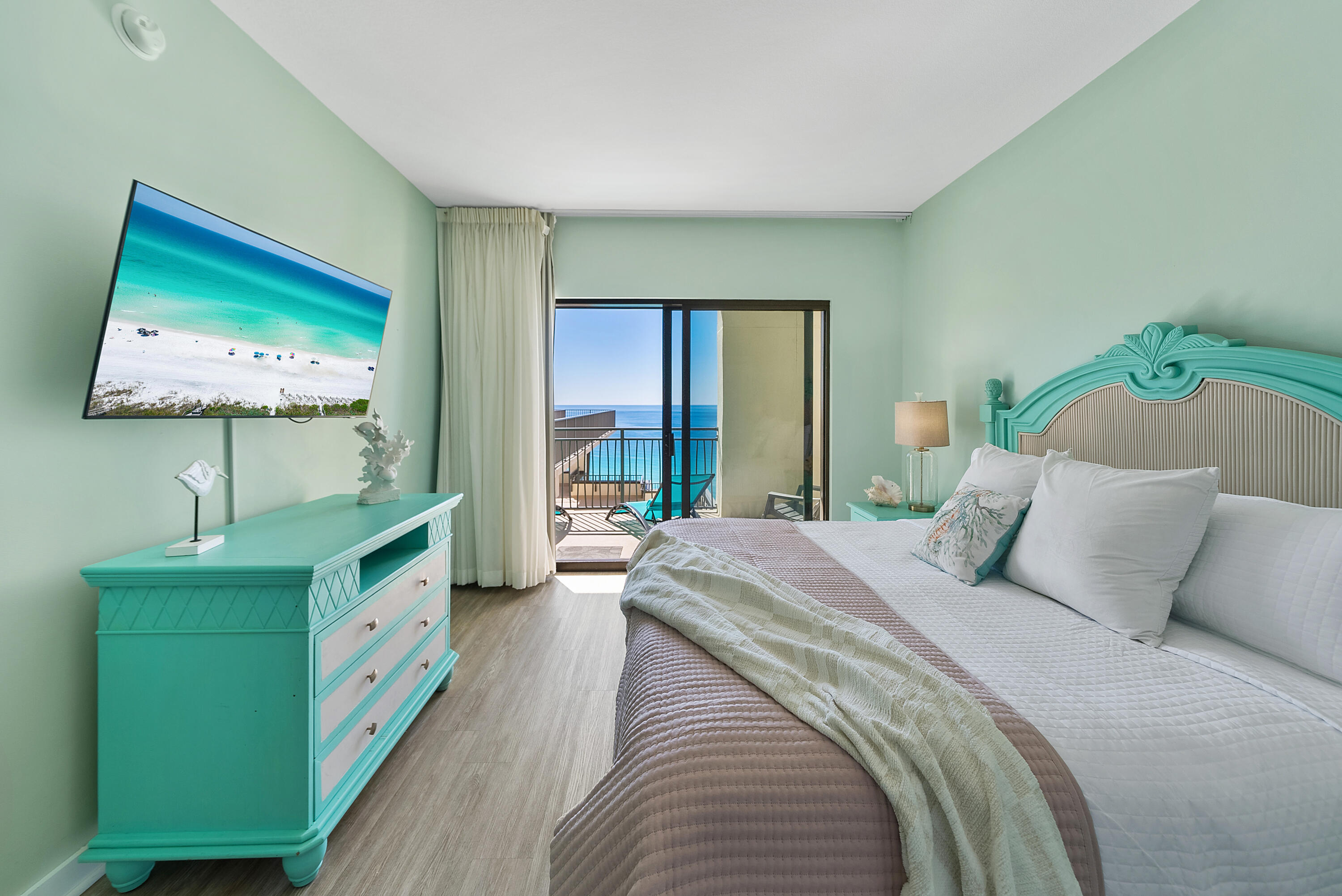15100 Front Beach Road, Unit 1604 Panama City Beach, FL 32413 - Photo 21 of 66 a bedroom with a bed and a flat screen tv