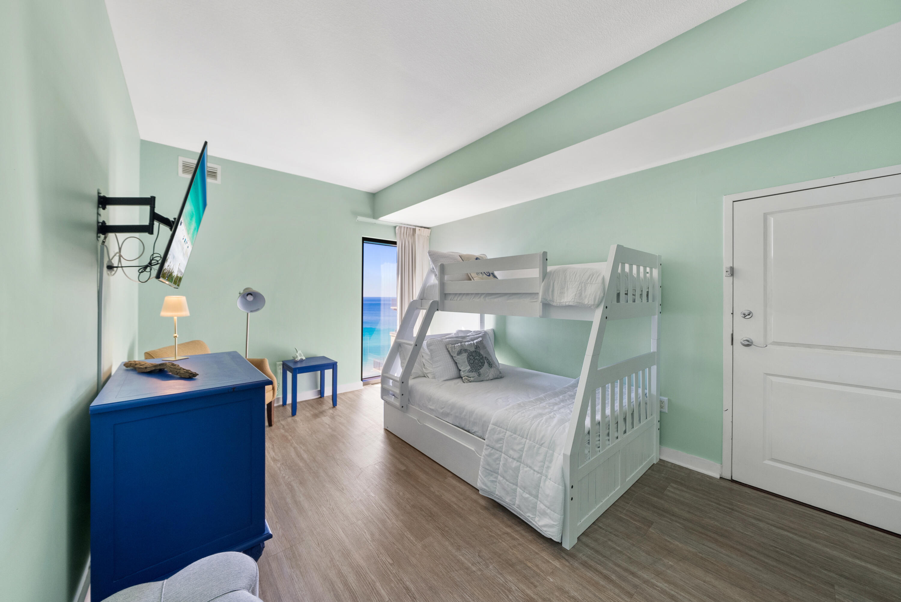 15100 Front Beach Road, Unit 1604 Panama City Beach, FL 32413 - Photo 40 of 66 a living room with furniture and wooden floor