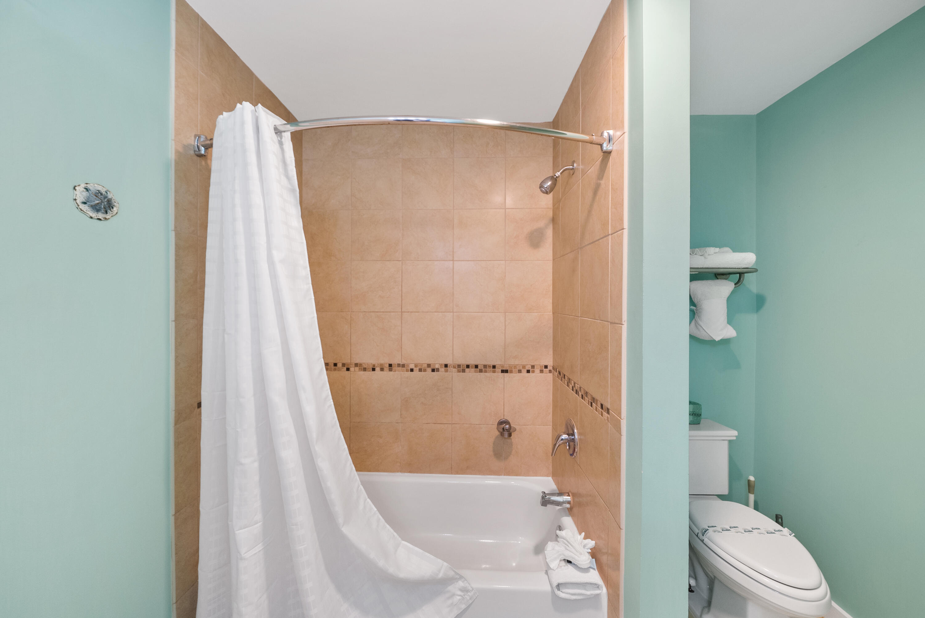 15100 Front Beach Road, Unit 1604 Panama City Beach, FL 32413 - Photo 48 of 66 a bathroom with a shower and a toilet