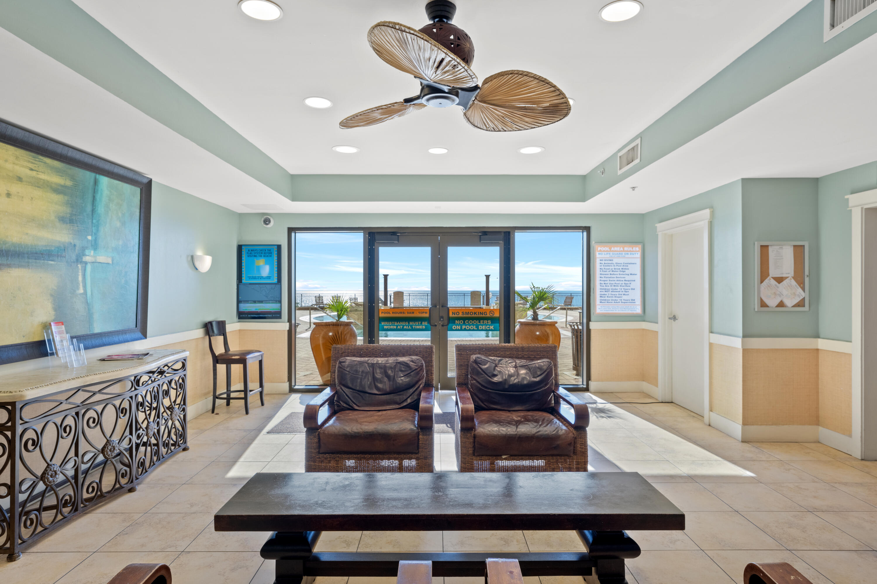 15100 Front Beach Road, Unit 1604 Panama City Beach, FL 32413 - Photo 55 of 66 a living room with furniture a rug and a large window