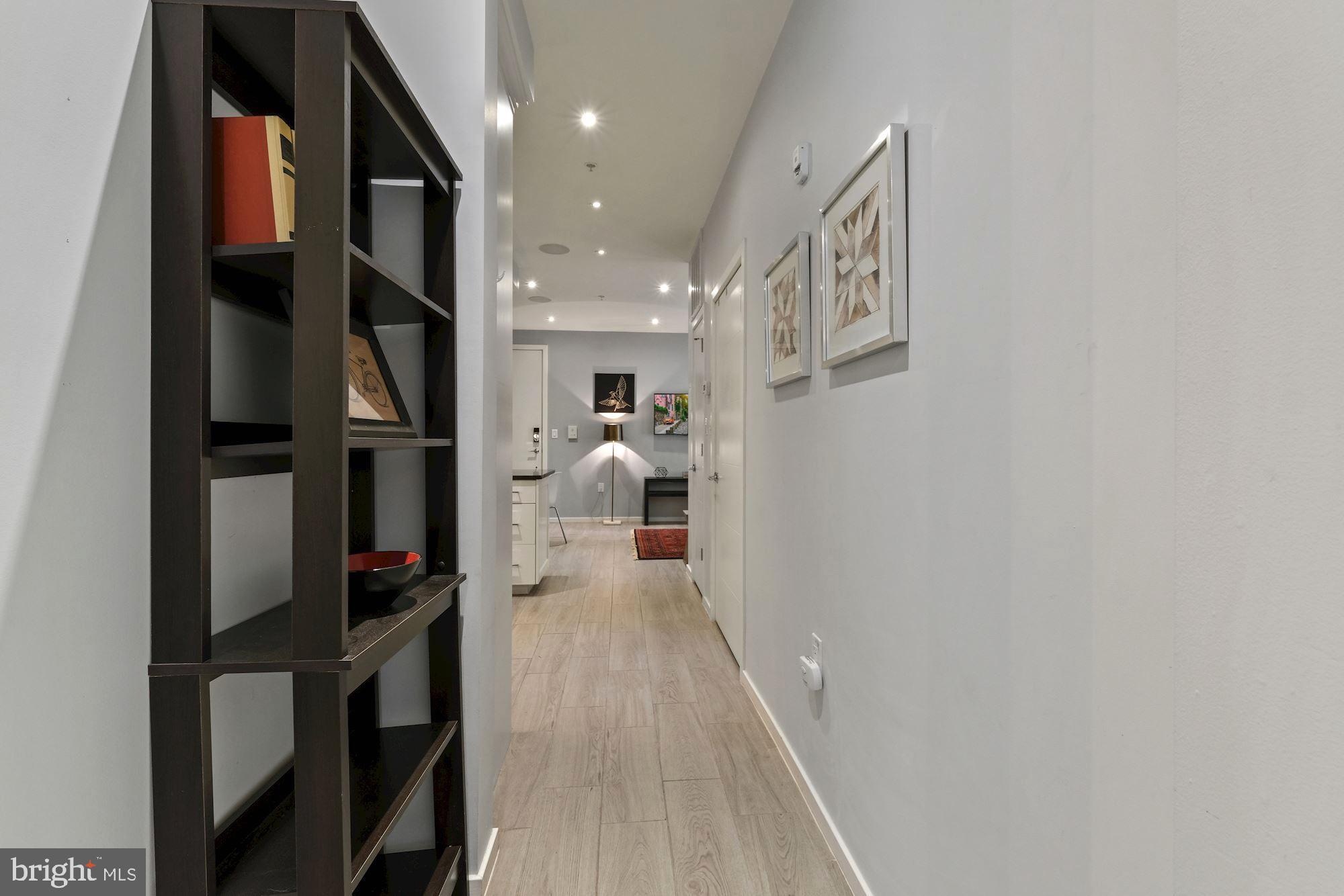 756 Park Road Northwest, Unit 2 Washington, DC 20010 - Photo 15 of 48 a hallway with a white stove top oven and kitchen island