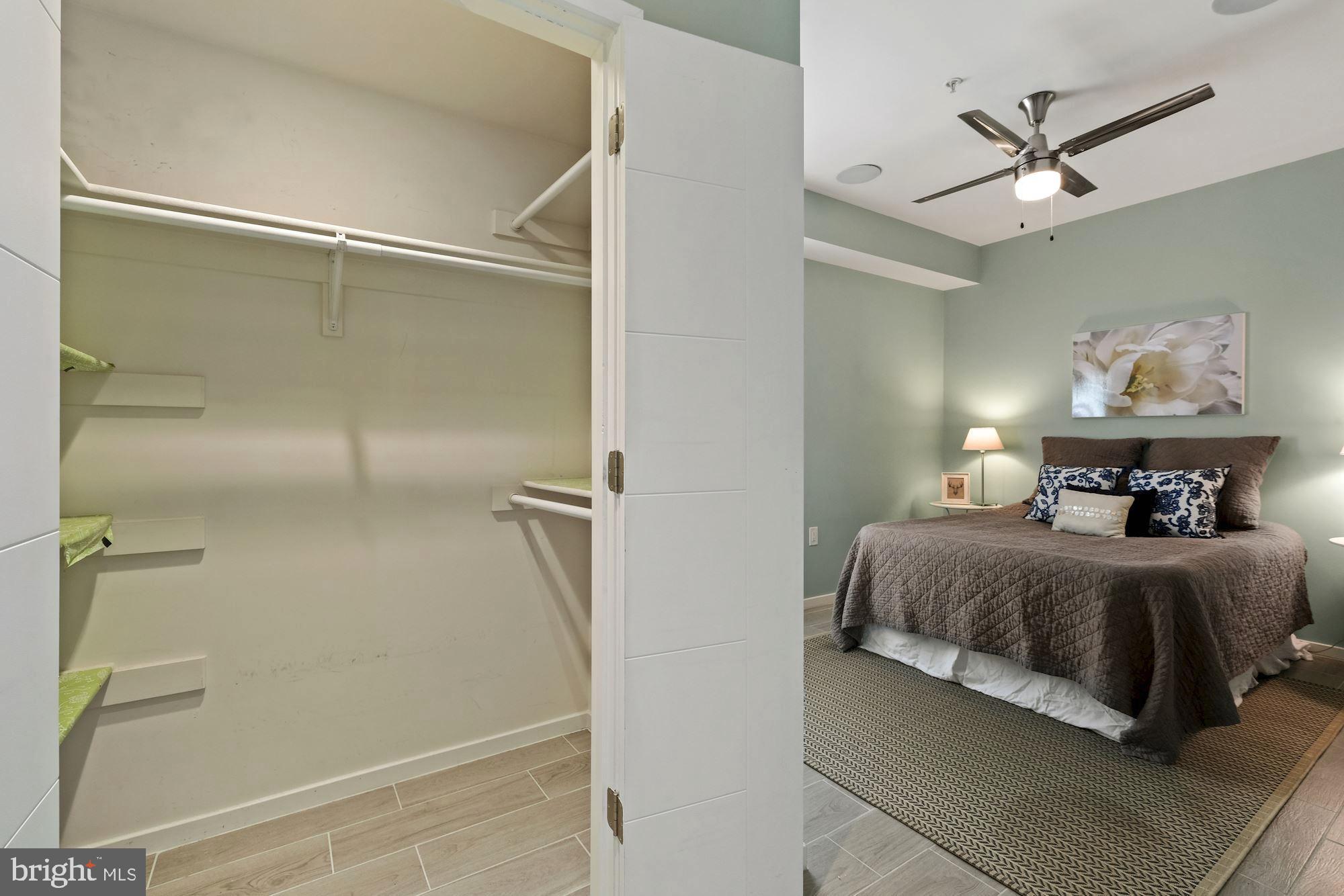 756 Park Road Northwest, Unit 2 Washington, DC 20010 - Photo 20 of 48 a bedroom with a bed and a ceiling fan