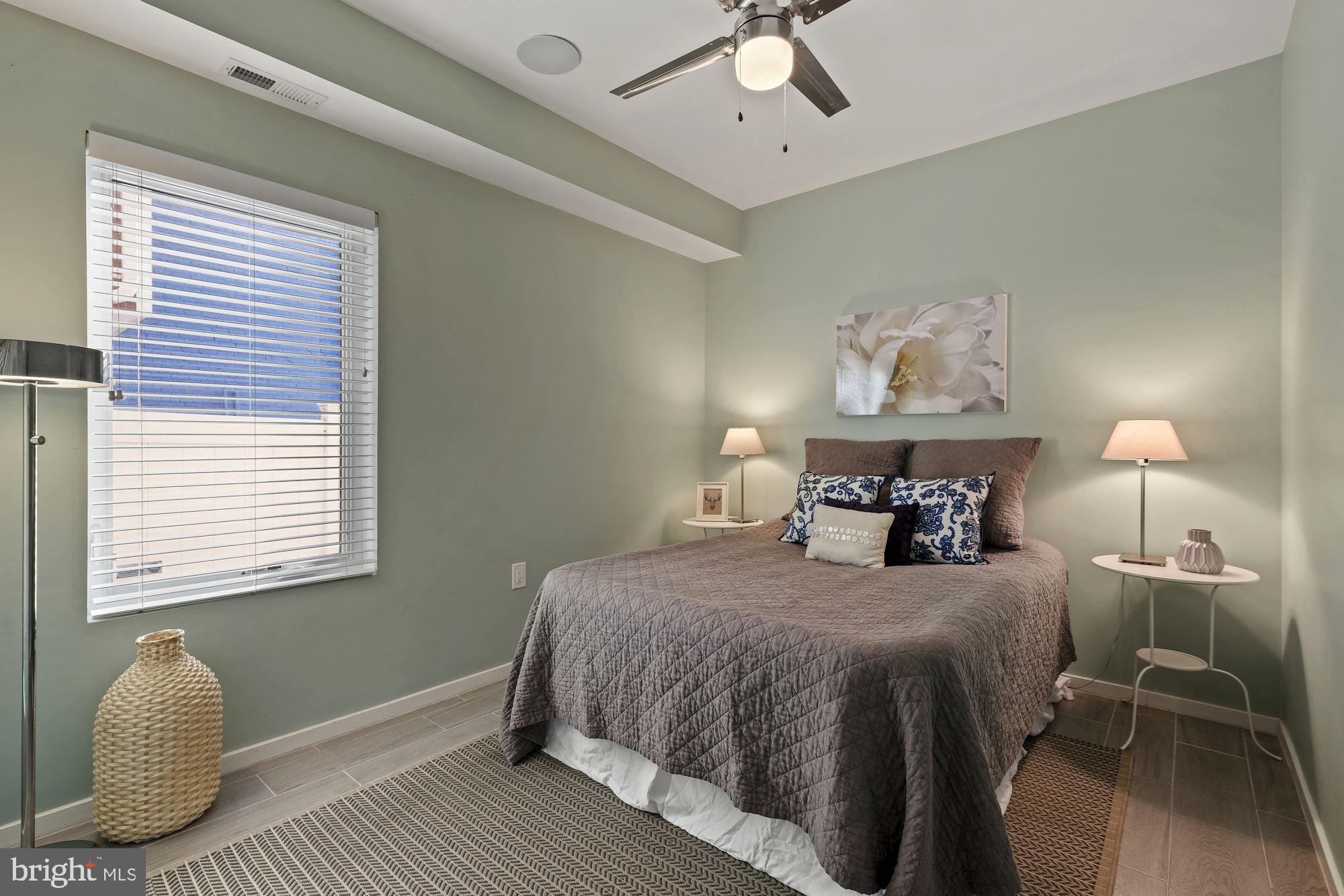 756 Park Road Northwest, Unit 2 Washington, DC 20010 - Photo 21 of 48 a bedroom with a bed and a window