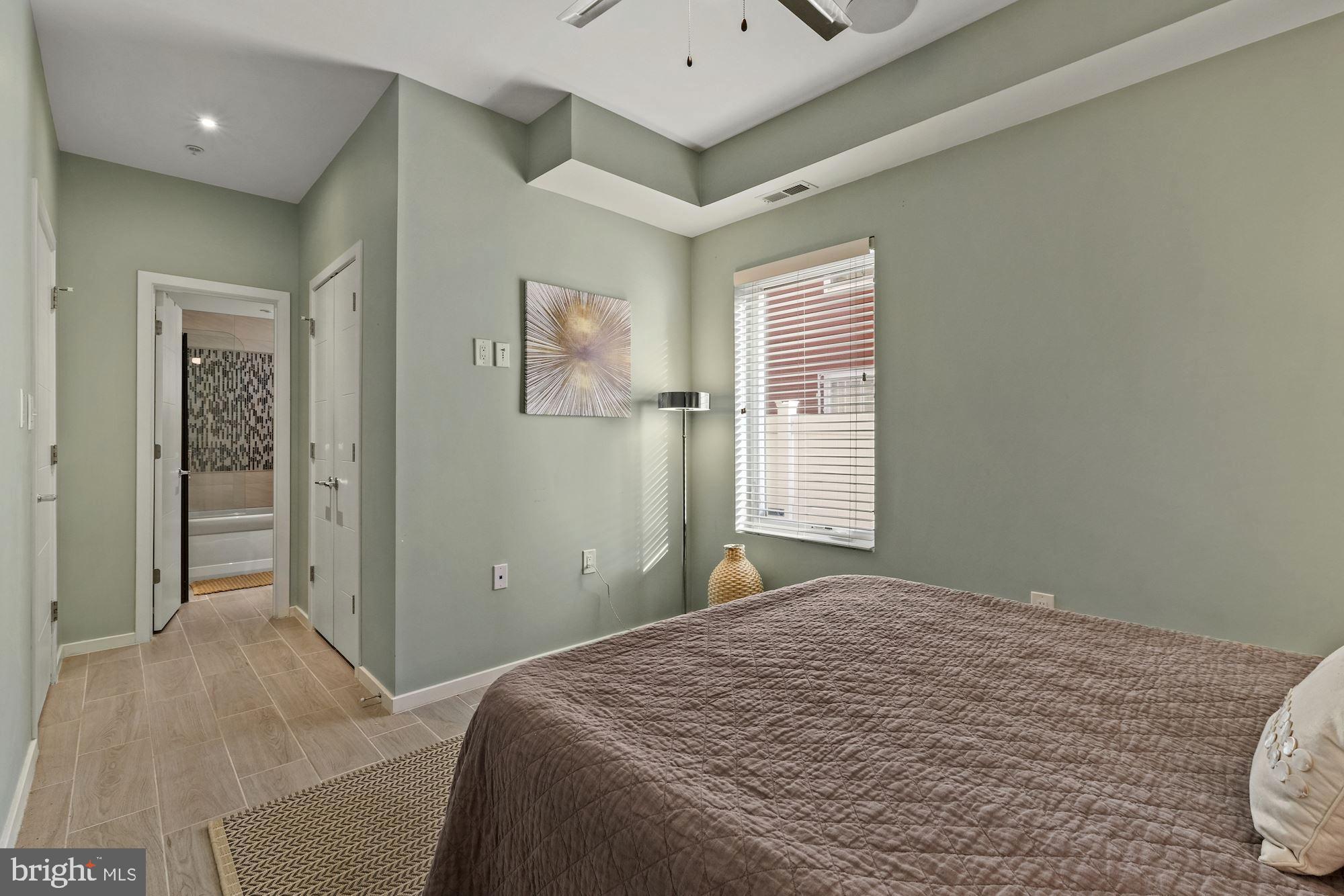 756 Park Road Northwest, Unit 2 Washington, DC 20010 - Photo 22 of 48 a bedroom with a bed and a window