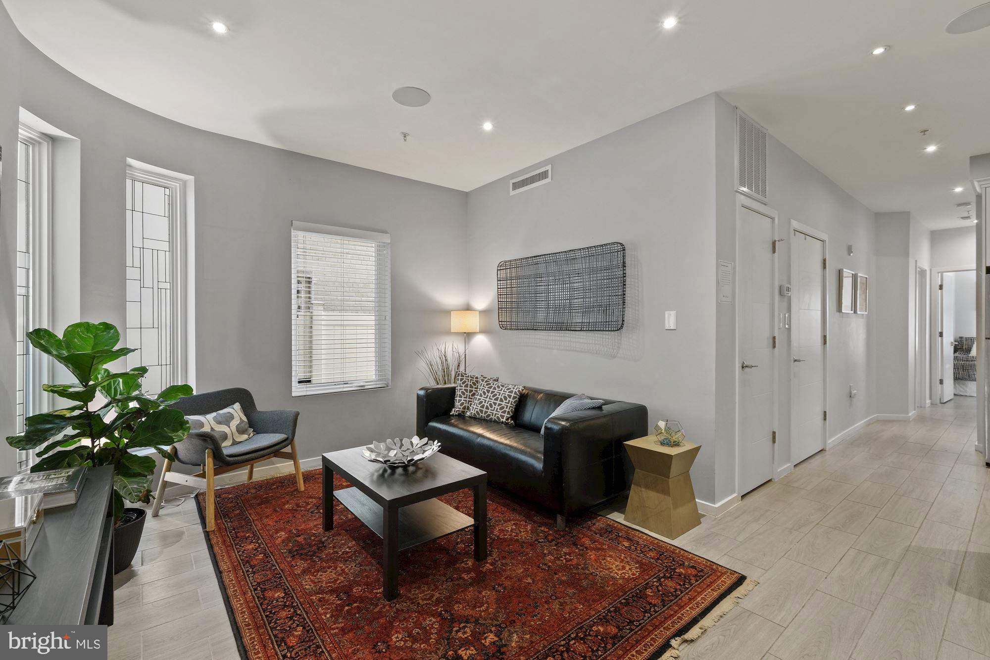 756 Park Road Northwest, Unit 2 Washington, DC 20010 - Photo 5 of 48 a living room with furniture potted plant and a window