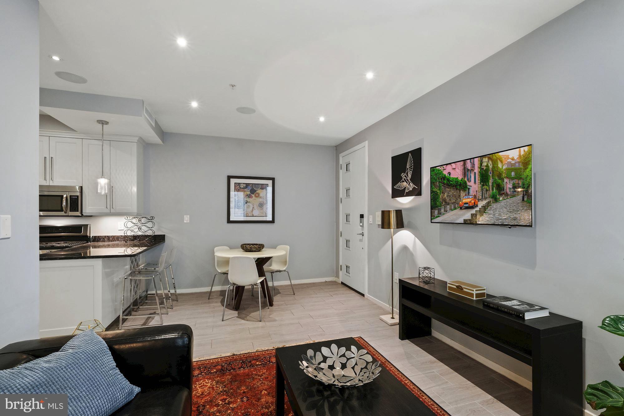 756 Park Road Northwest, Unit 2 Washington, DC 20010 - Photo 7 of 48 a living room with furniture and a flat screen tv