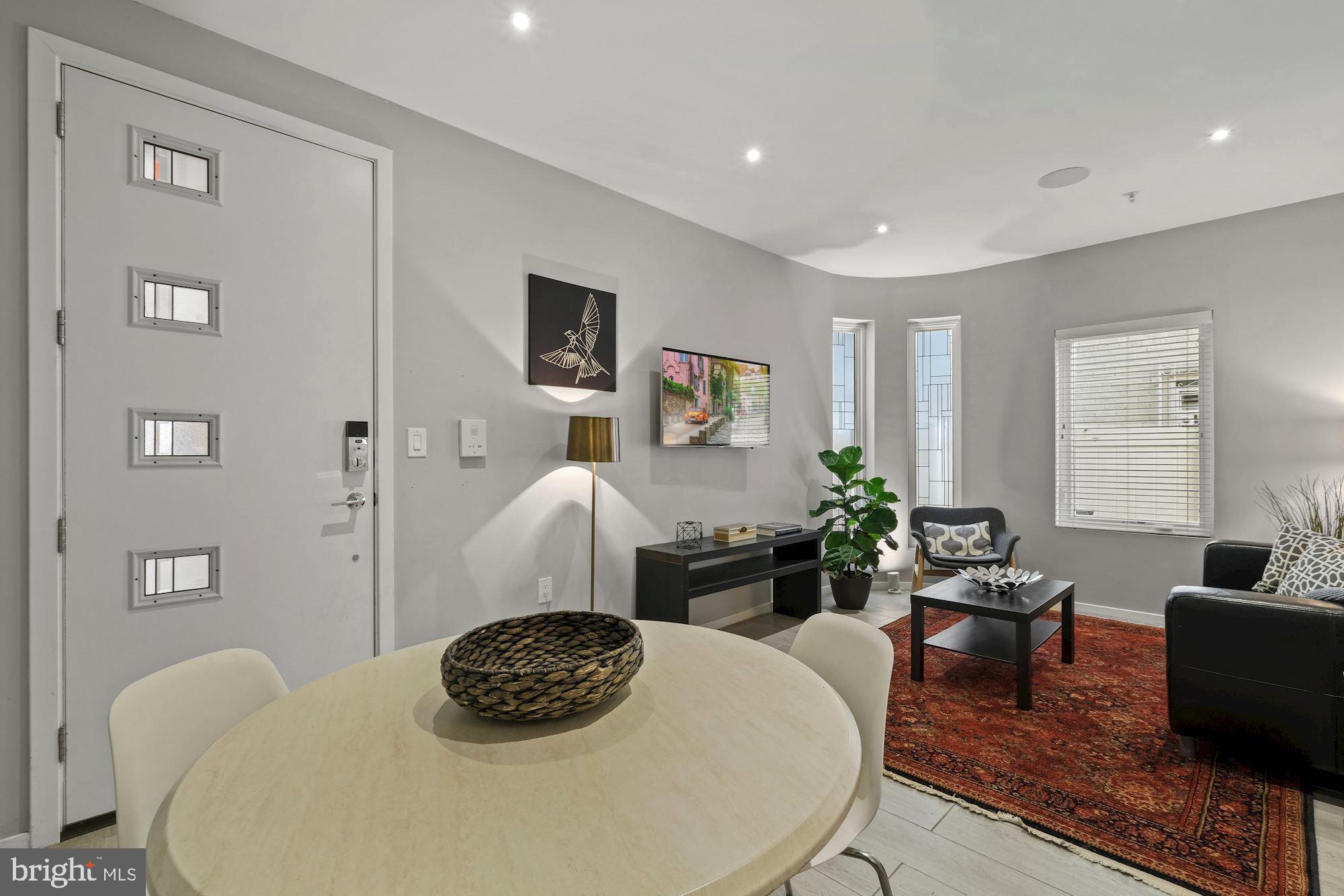756 Park Road Northwest, Unit 2 Washington, DC 20010 - Photo 9 of 48 a living room with furniture and a table