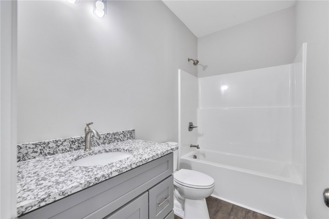 2009 Aberdeen Lane Walhalla, SC 29691 - Photo 13 of 43 This sleek bathroom features a modern vanity with a spacious countertop, alongside a pristine shower and tub.