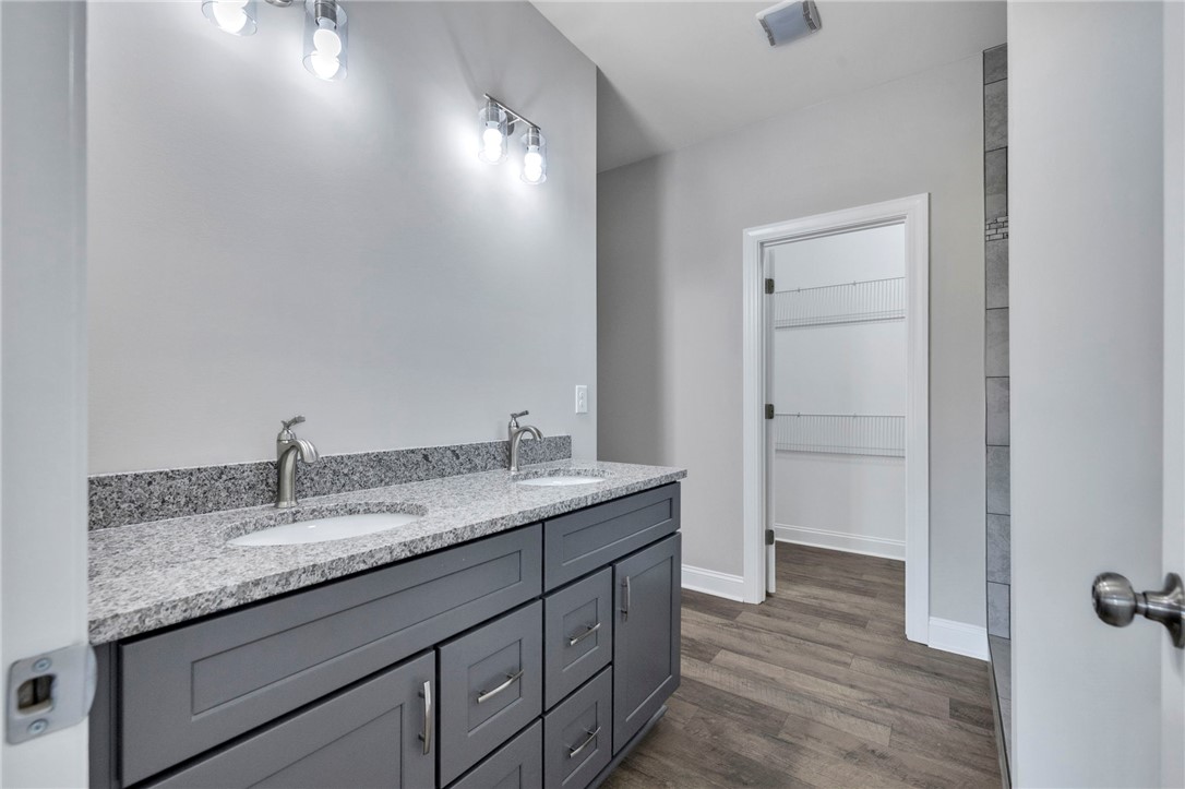 2009 Aberdeen Lane Walhalla, SC 29691 - Photo 21 of 43 This bathroom features a double vanity with granite counters and a spacious walk-in closet.