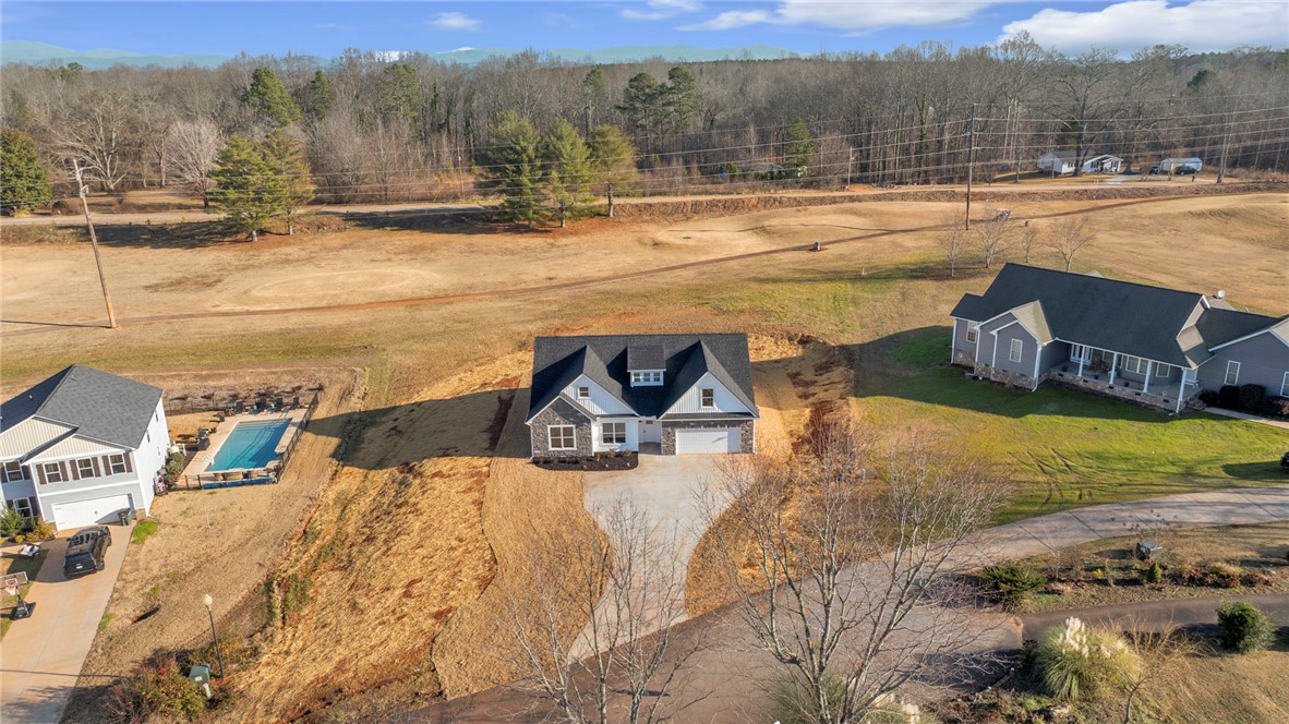 2009 Aberdeen Lane Walhalla, SC 29691 - Photo 32 of 43 An aerial view captures a serene home nestled in a rural landscape, boasting a private pool.