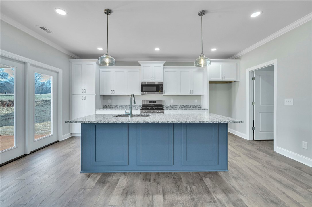 2009 Aberdeen Lane Walhalla, SC 29691 - Photo 7 of 43 This kitchen showcases a central island and contemporary amenities, creating an inviting culinary space.