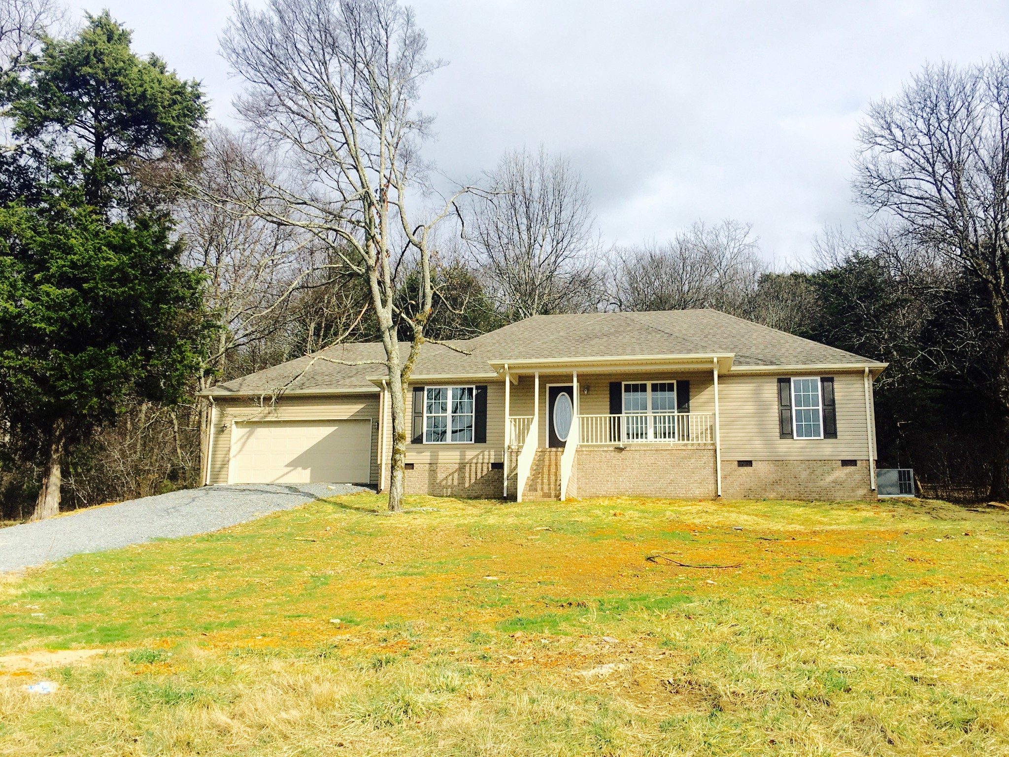 45 Cecil Johnson Road Mulberry, TN 37359 - Photo 1 of 12 a view of a white house with a large pool