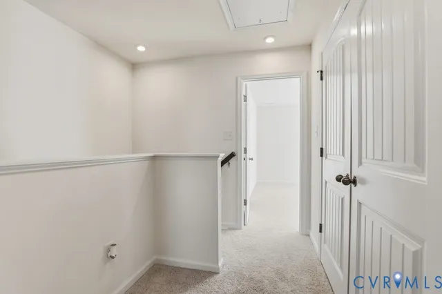 a view of a hallway with closet area