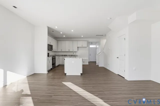 a view of kitchen with wooden floor