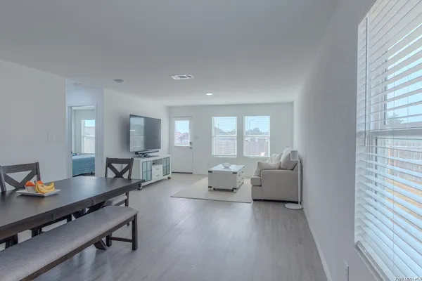 a living room with furniture and a table
