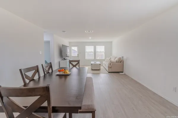 a kitchen with stainless steel appliances wooden cabinets and a stove top oven