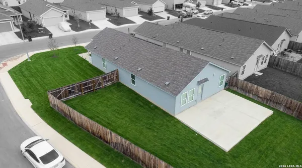 a view of an house with backyard space and garden