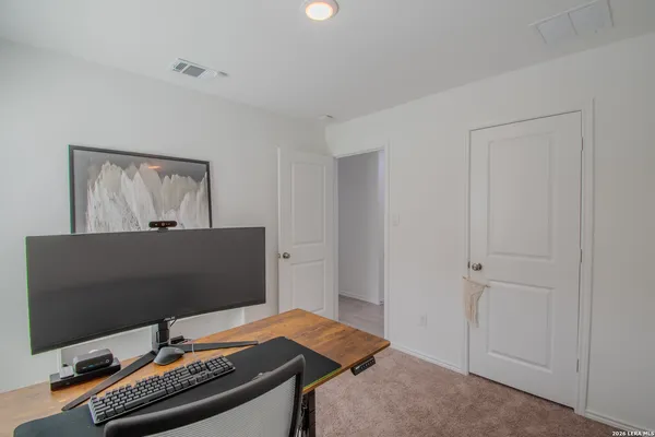 a view of a workspace with furniture