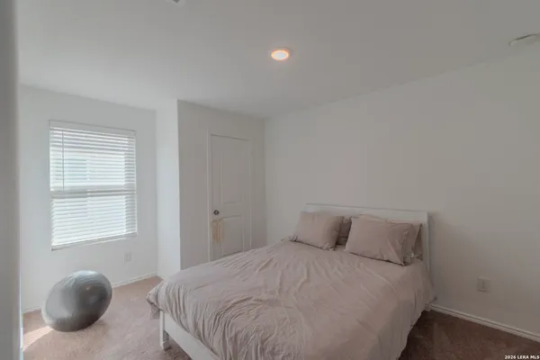 a bedroom with a bed and a closet