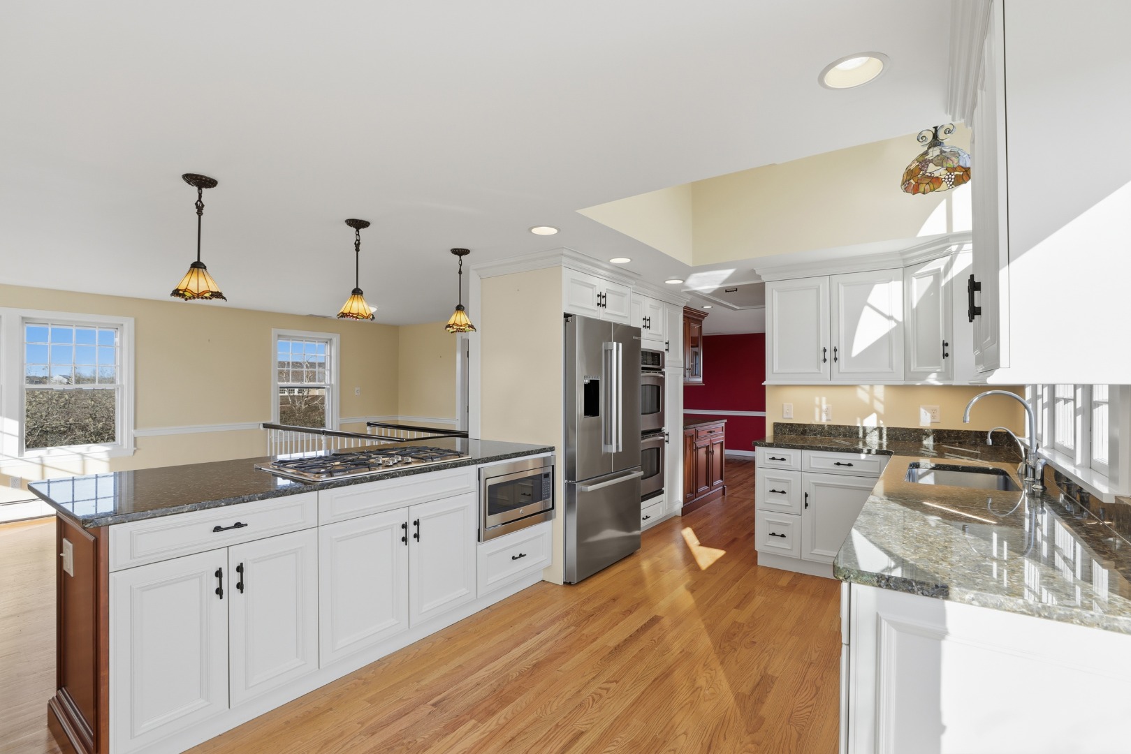 31 Flintlock Road Nantucket, MA 02554 - Photo 7 of 23 a kitchen with stainless steel appliances kitchen island granite countertop a sink and cabinets