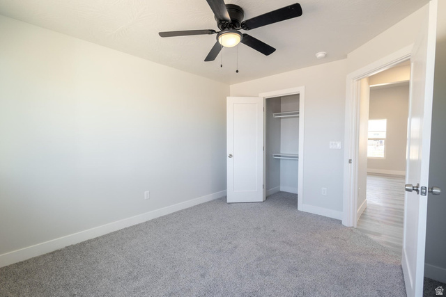 910 East Remington Road Cedar City, UT 84721 - Photo 11 of 29 Spacious room featuring light gray carpeting, a built-in closet with shelving, a ceiling fan with integrated lighting, and white trim