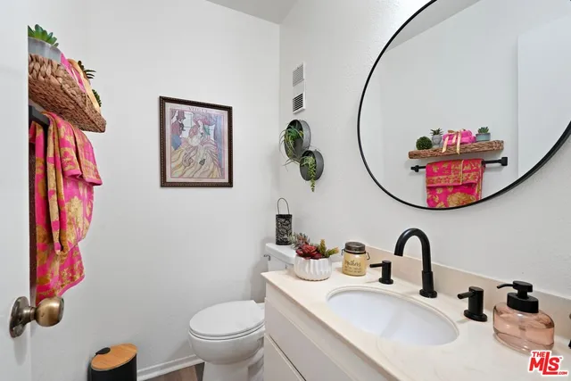 a bathroom with a toilet and a sink