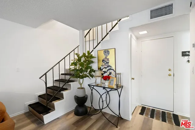 a view of entryway with wooden floor