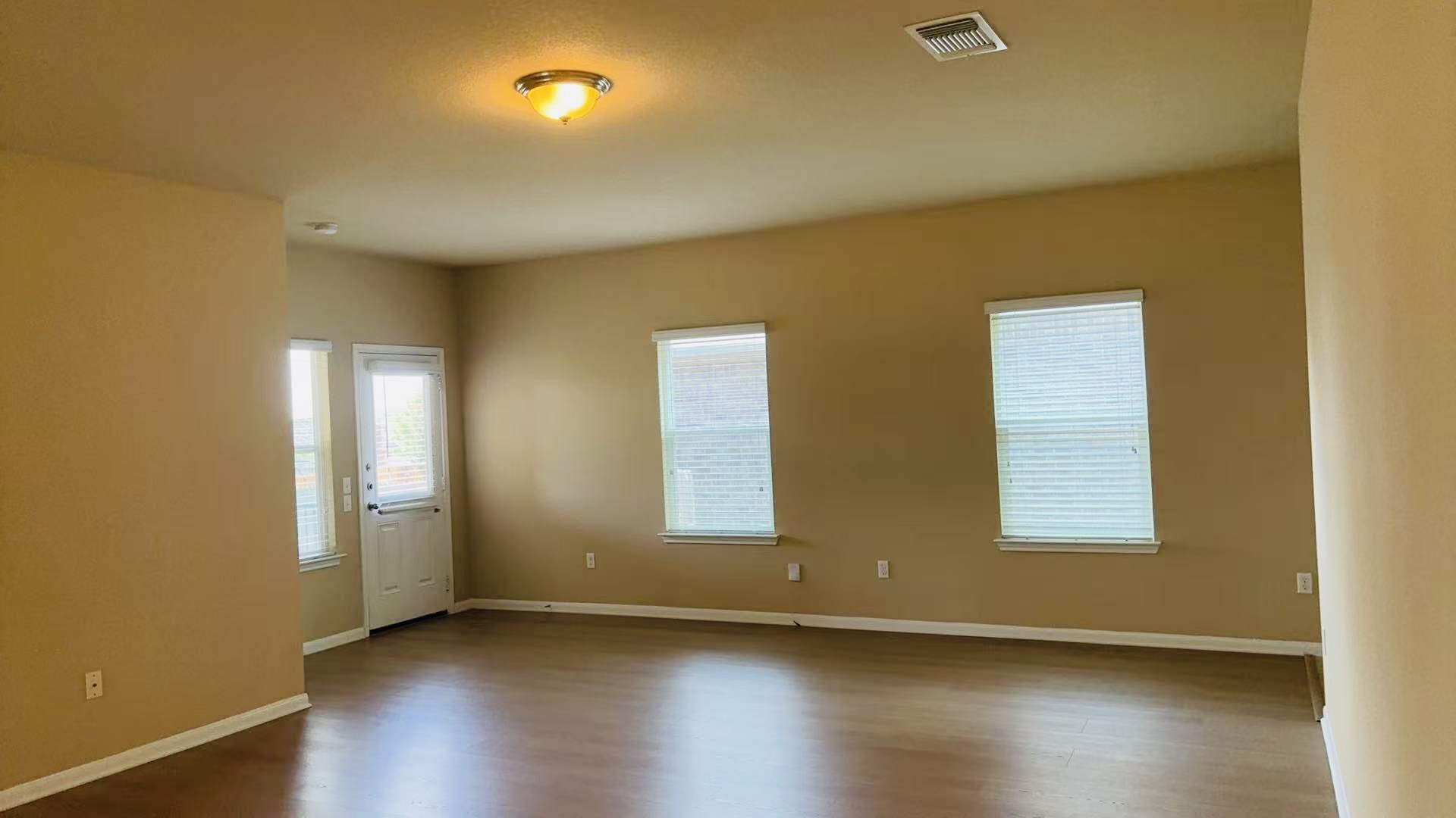 1602 Atlas Road Cedar Park, TX 78613 - Photo 6 of 13 A spacious living area with warm walls and rich flooring awaits your personal touch.