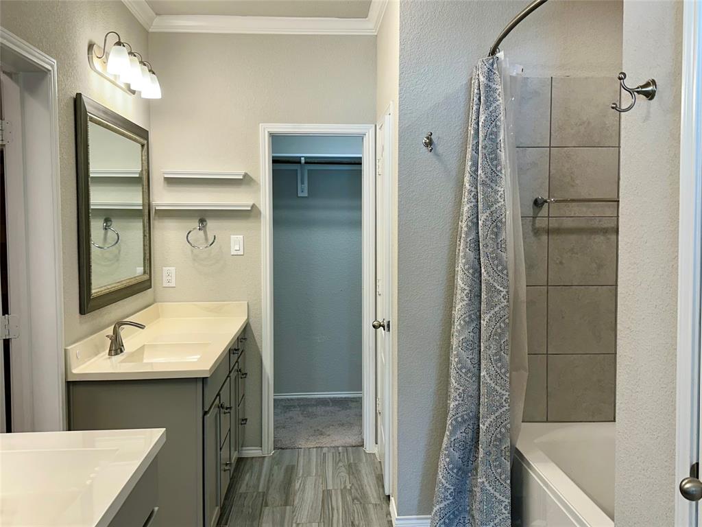 3716 Fossil Tree Lane Fort Worth, TX 76244 - Photo 14 of 30 a bathroom with a sink a toilet a shower and a mirror