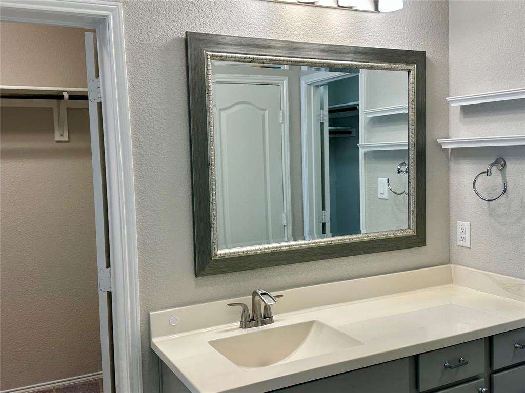 3716 Fossil Tree Lane Fort Worth, TX 76244 - Photo 18 of 30 a bathroom with a sink and a mirror