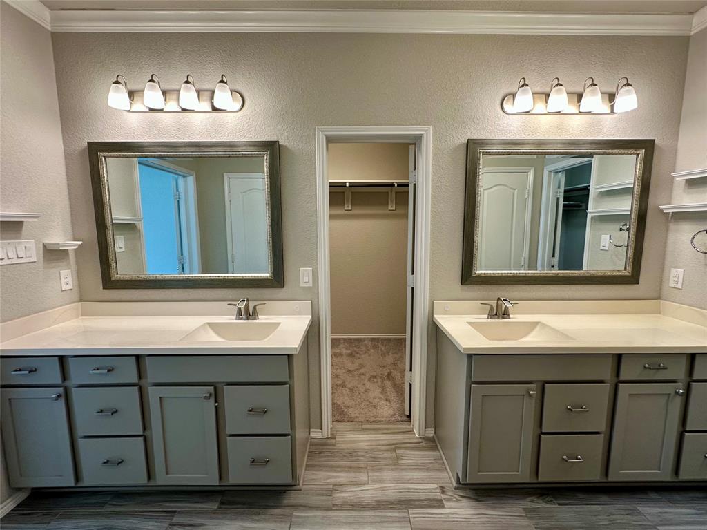 3716 Fossil Tree Lane Fort Worth, TX 76244 - Photo 19 of 30 a bathroom with a double vanity sink and a mirror