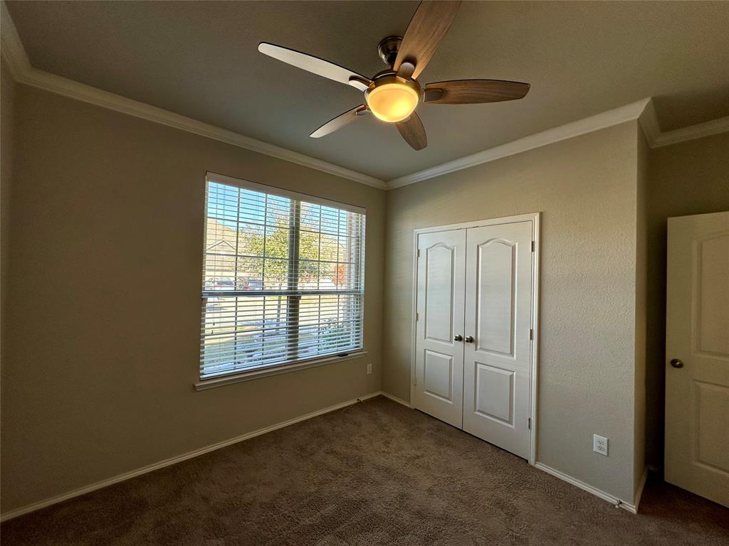 3716 Fossil Tree Lane Fort Worth, TX 76244 - Photo 22 of 30 an empty room with windows and fan