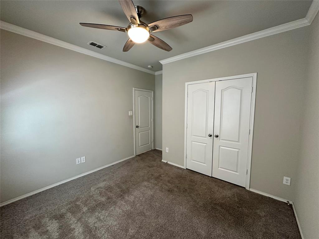 3716 Fossil Tree Lane Fort Worth, TX 76244 - Photo 24 of 30 an empty room with a ceiling fan and a window