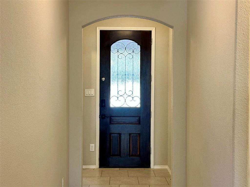 3716 Fossil Tree Lane Fort Worth, TX 76244 - Photo 3 of 30 a view of a entryway door with wooden floor