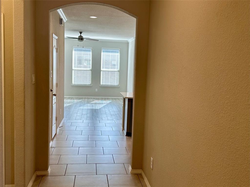 3716 Fossil Tree Lane Fort Worth, TX 76244 - Photo 4 of 30 a view of a hallway with white walls