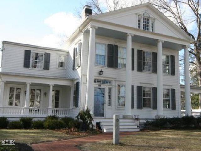 325 Main Street Ridgefield, CT 06877 - Photo 1 of 1 a front view of a house with lots of windows and plants