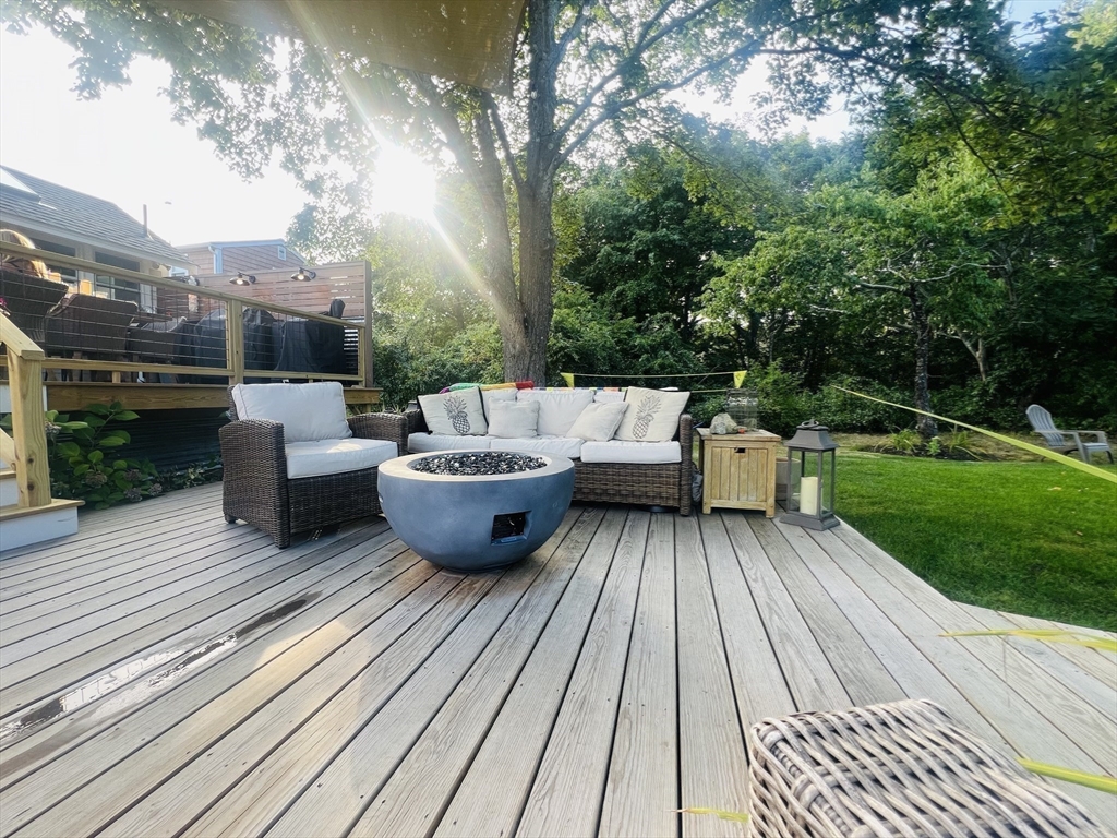 4 R Old County Road Rockport, MA 01966 - Photo 26 of 29 a view of a patio with couches table and chairs and potted plants