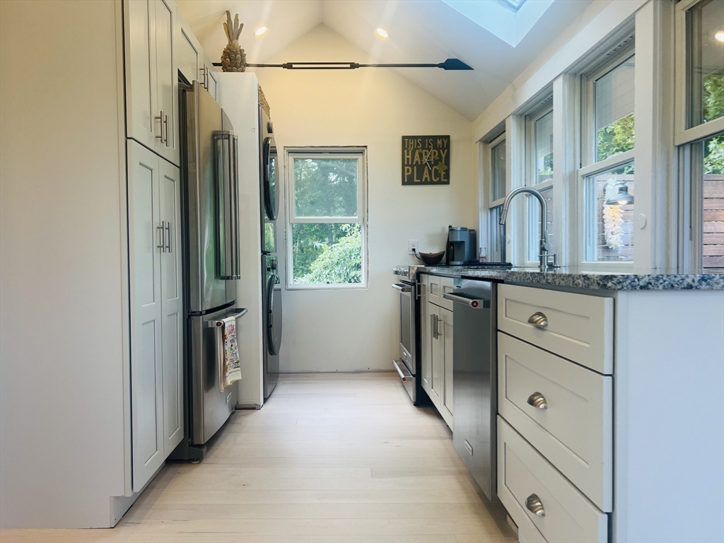 4 R Old County Road Rockport, MA 01966 - Photo 9 of 29 a kitchen with stainless steel appliances granite countertop a refrigerator and a sink