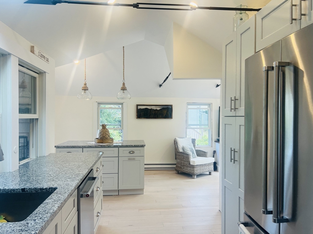 4 R Old County Road Rockport, MA 01966 - Photo 10 of 29 a kitchen with stainless steel appliances granite countertop a sink and a refrigerator