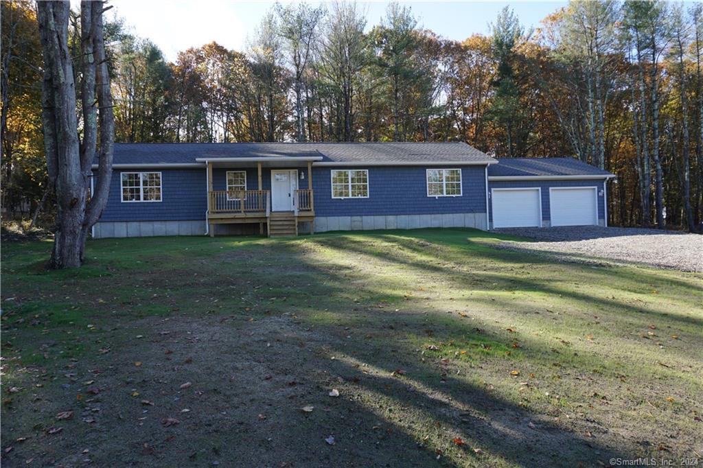 a view of a house with a yard