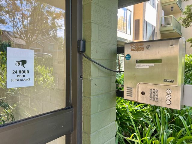 a view of a building with a yard