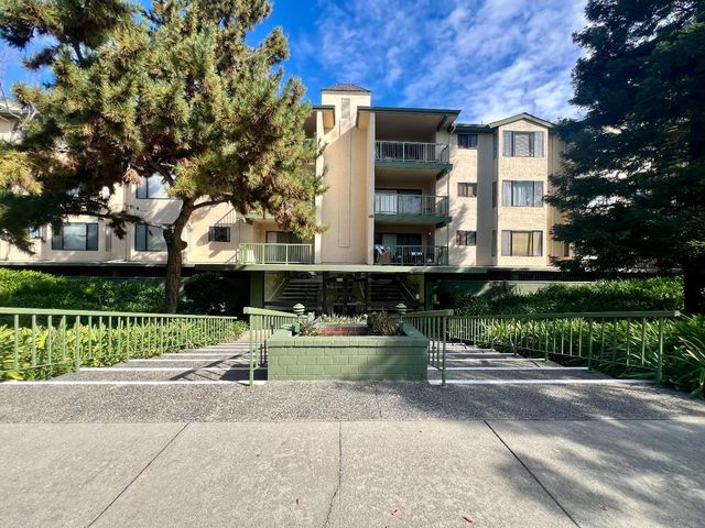a view of a hallway with windows