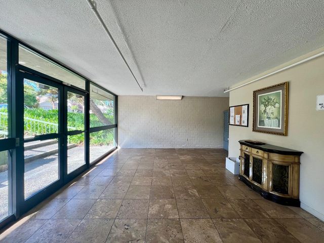 a view of a balcony with a floor to ceiling window