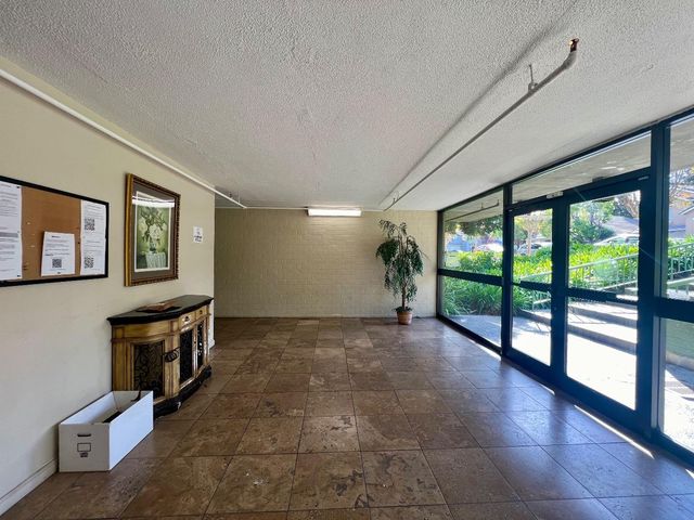 a view of parking garage with cars