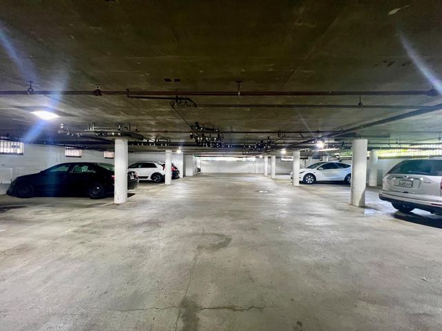 a view of an empty room and staircase