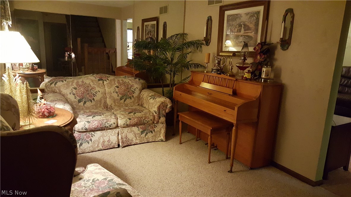 Mirrored Sitting Room Just inside Entrance to the Left